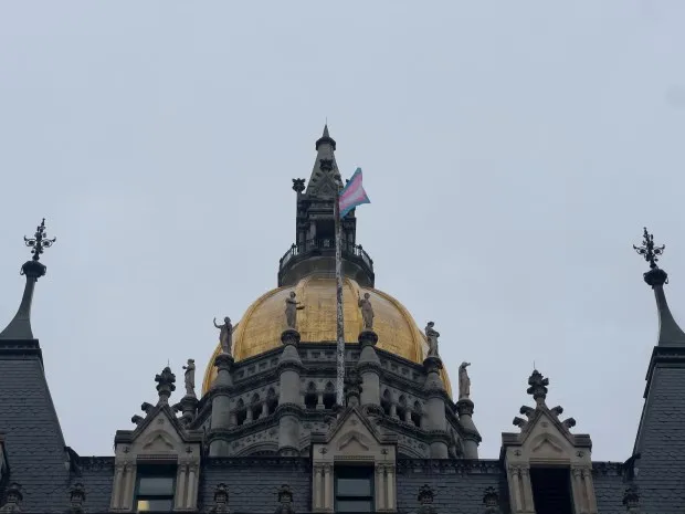 Thursday, the transgender pride flag flies in the wind above the Connecticut State Capitol. In honor of the International Transgender Day of Visibility, officials raised the flag.