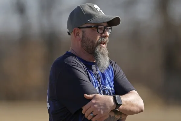 Dusty Farr talks about his efforts to fight bathroom bans after his transgender daughter while visiting a park with his daughter near Smithville, Mo., Sunday, Feb. 25, 2024. Farr is suing the Platt County School District after his daughter was suspended for using the girl's bathroom at the Missouri high school she attended. (AP Photo/Charlie Riedel)