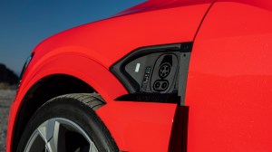 A close-up of the charging port on a 2024 Audi SQ8 e-tron Sportback.