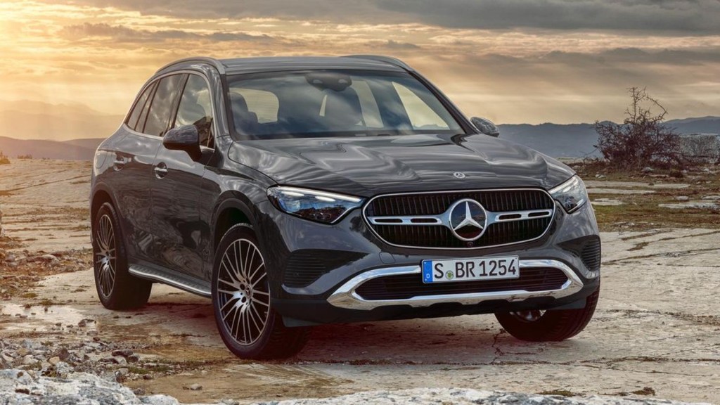 Mercedes-Benz GLC-Class posed on a beach at sunset. 