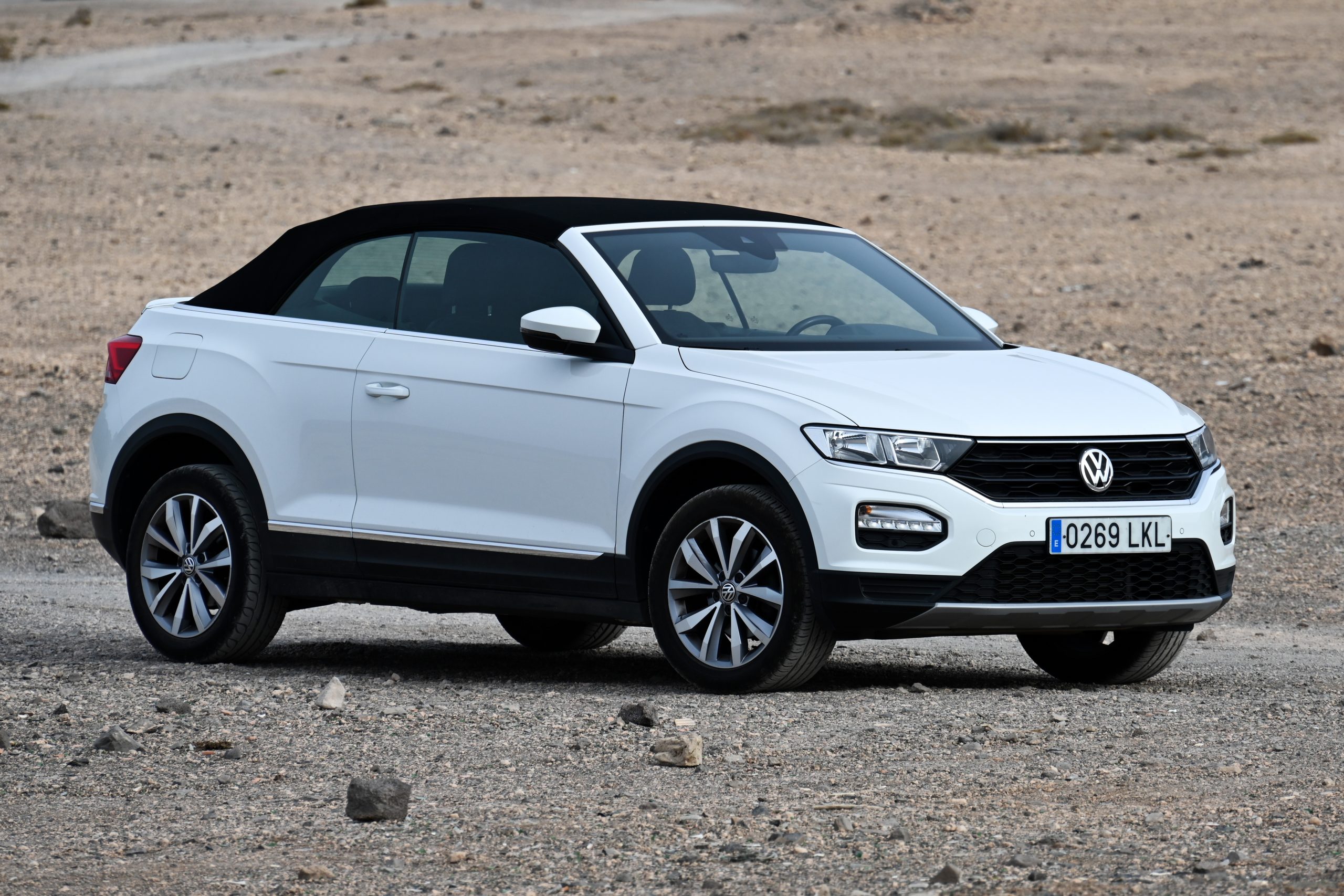 A white Volkswagen T-Roc Cabriolet with a closed top