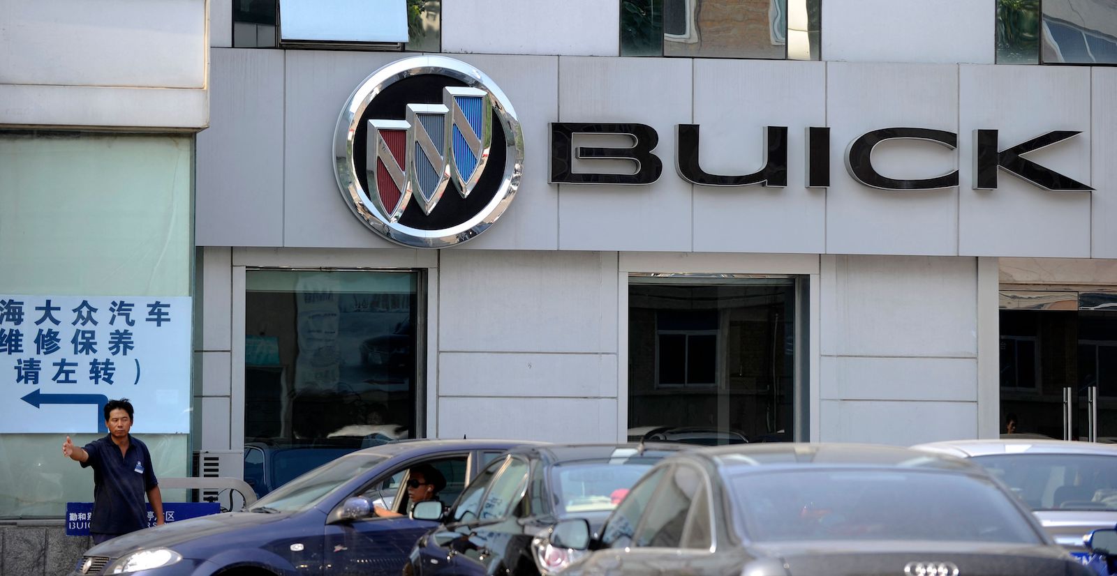 Buick cars parked in a lot outside a Chinese dealership