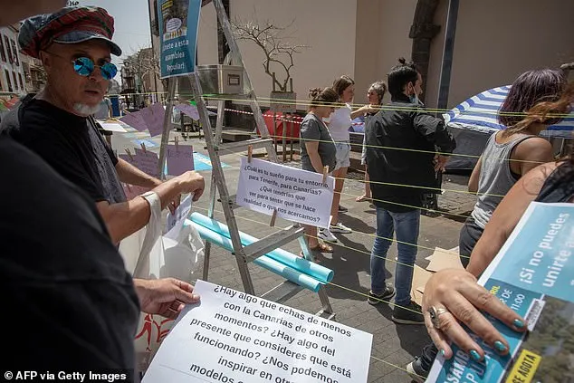 Members of the 'Canaria se agota' ('Canaria is exhausted') movement take part in a protest against the constuction of a hotel near La Tejita playa and other mass tourism infrastructures, on April 13, 2024