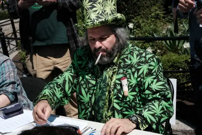 An activist hands out free marijuana cigarettes to people after they show proof of a Covid-19 vaccination at Union Square on April 20, 2021 in New York City. The event, which attracted hundreds, was held in honor of “4/20” and the efforts to get more New Yorkers vaccinated. Called “Joints For Jabs,