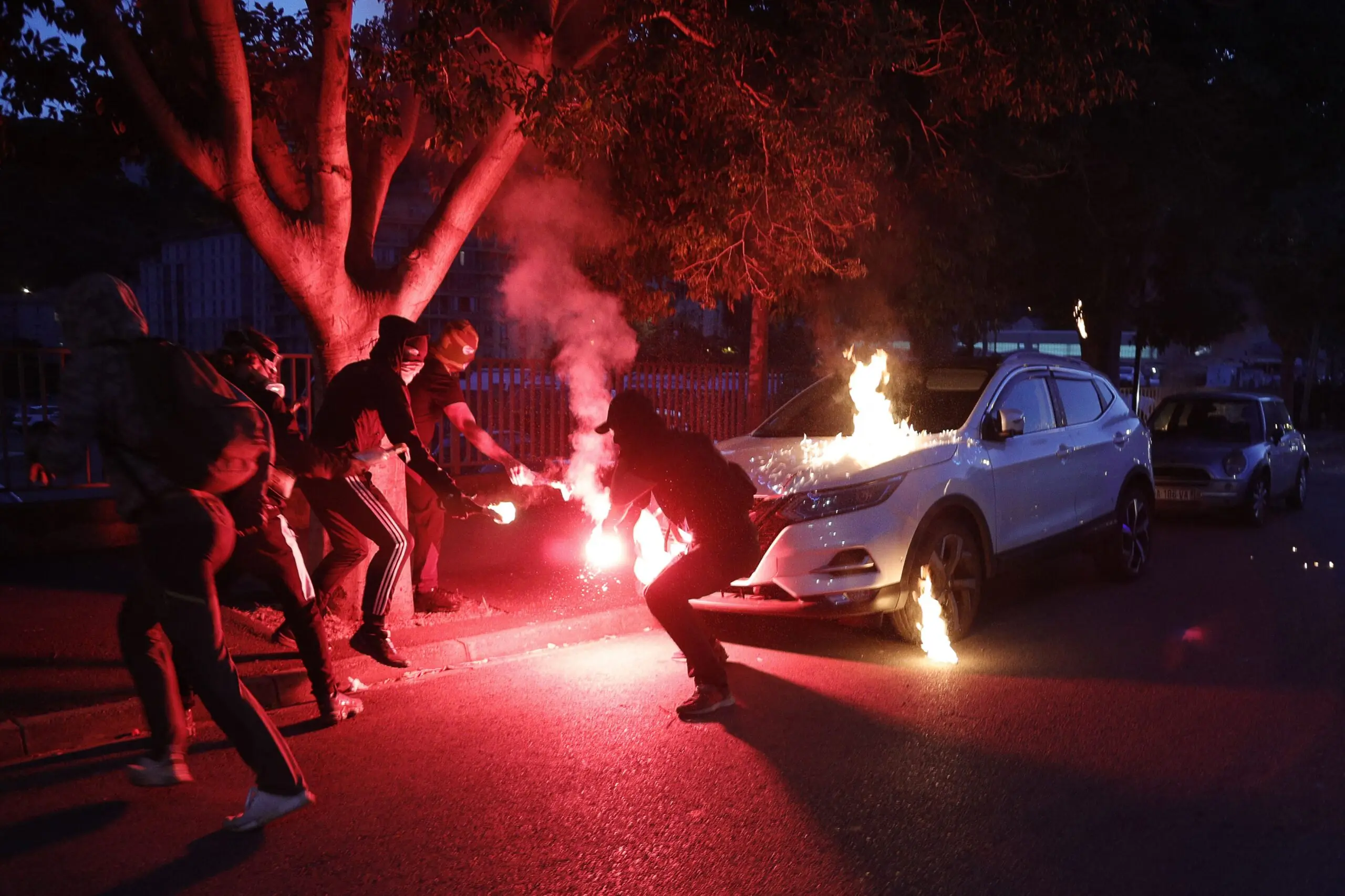 Protesters light flares and petrol bombs in 2022