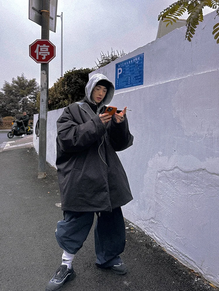 korean men's fashion: Dark Oversized Coat + Gray Hoodie + Dark Baggy Pants + Black Sneakers