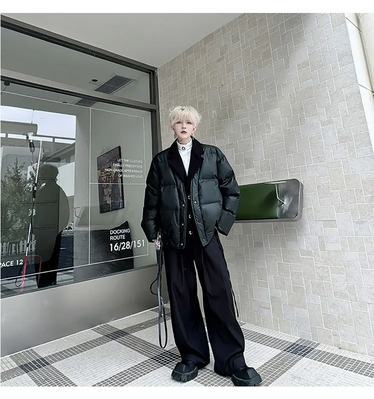 Korean Men's fashion: Glossy Black Puffer Jacket Layered Over A Tailored Blazer + Crisp White Shirt + Wide-Leg Black Trousers + Chunky Black Platform