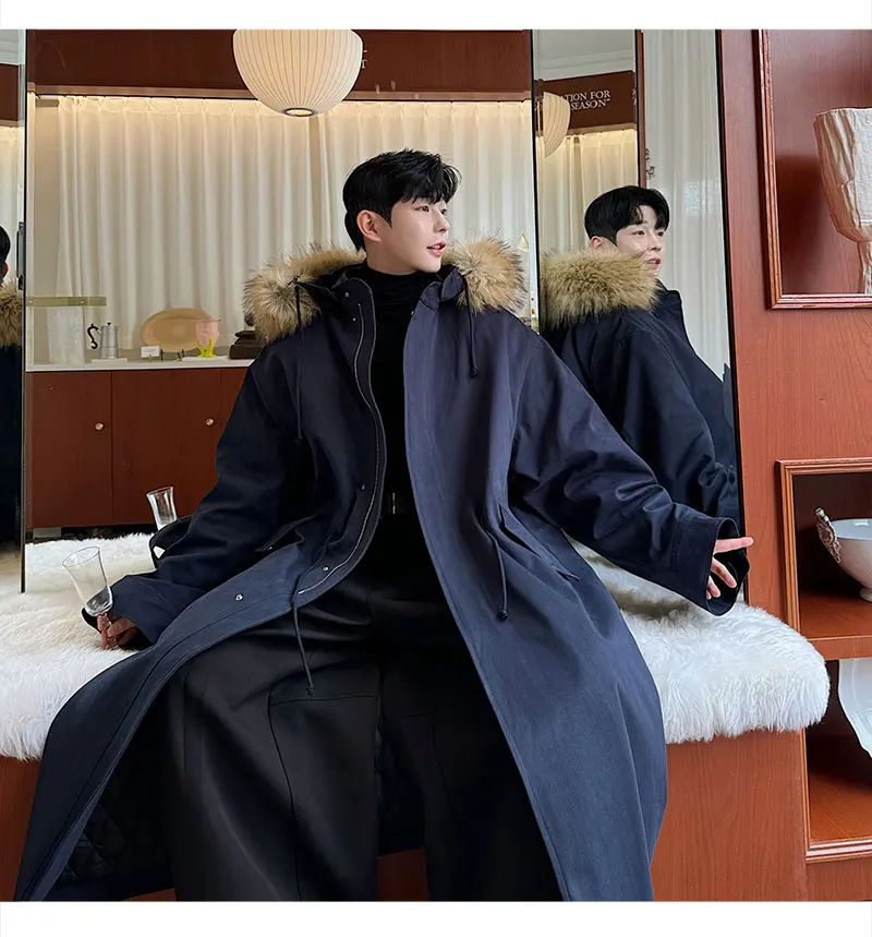 korean men's fashion: Oversized Black Puffer Coat + Sleek Wide-Leg Trousers + Monochromatic Inner Layer