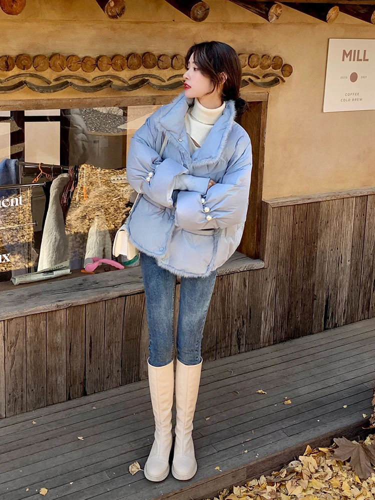 Elegant Winter Korean Look: Pastel Puffer Jacket with Skinny Jeans and Tall Boots