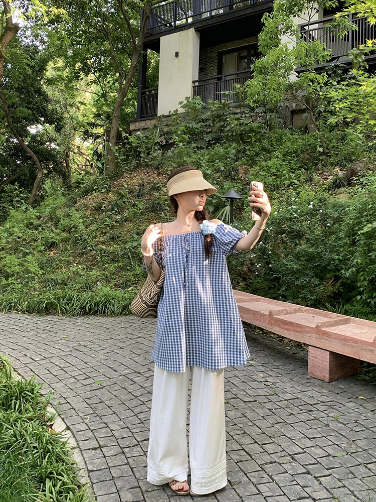 Gingham Off-Shoulder Tunic + Oversize Floral Pin + White Voile Palazzo Pants + Woven Visor + Beige Flip-Flops