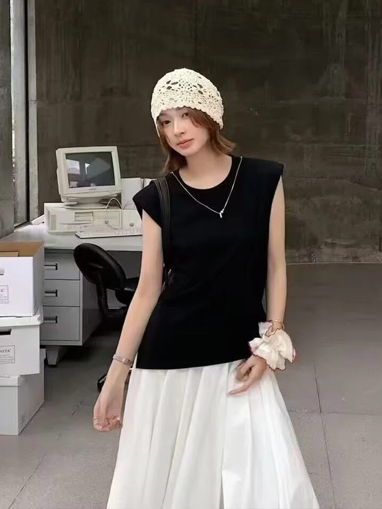 Crochet Ivory Beanie + Black Sleeveless Muscle Tee + White Pleated Midi Skirt + Black Shoulder Bag + Scrunchie Bracelet + White Canvas Sneakers