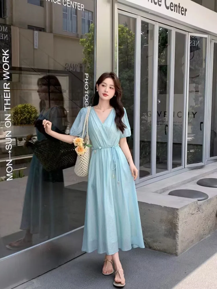 Sky-Blue Wrap Maxi Dress + Slim Tassel Rope Belt + Crochet Shoulder Tote + Drop Earrings + Beige T-Strap Sandals