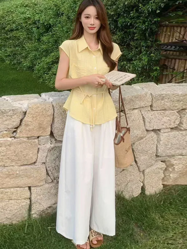 Butter-Yellow Drawstring Collared Blouse + White Wide-Leg Palazzo Pants + Canvas-Trim Tote + Gold Pendant + Brown Cork Slides