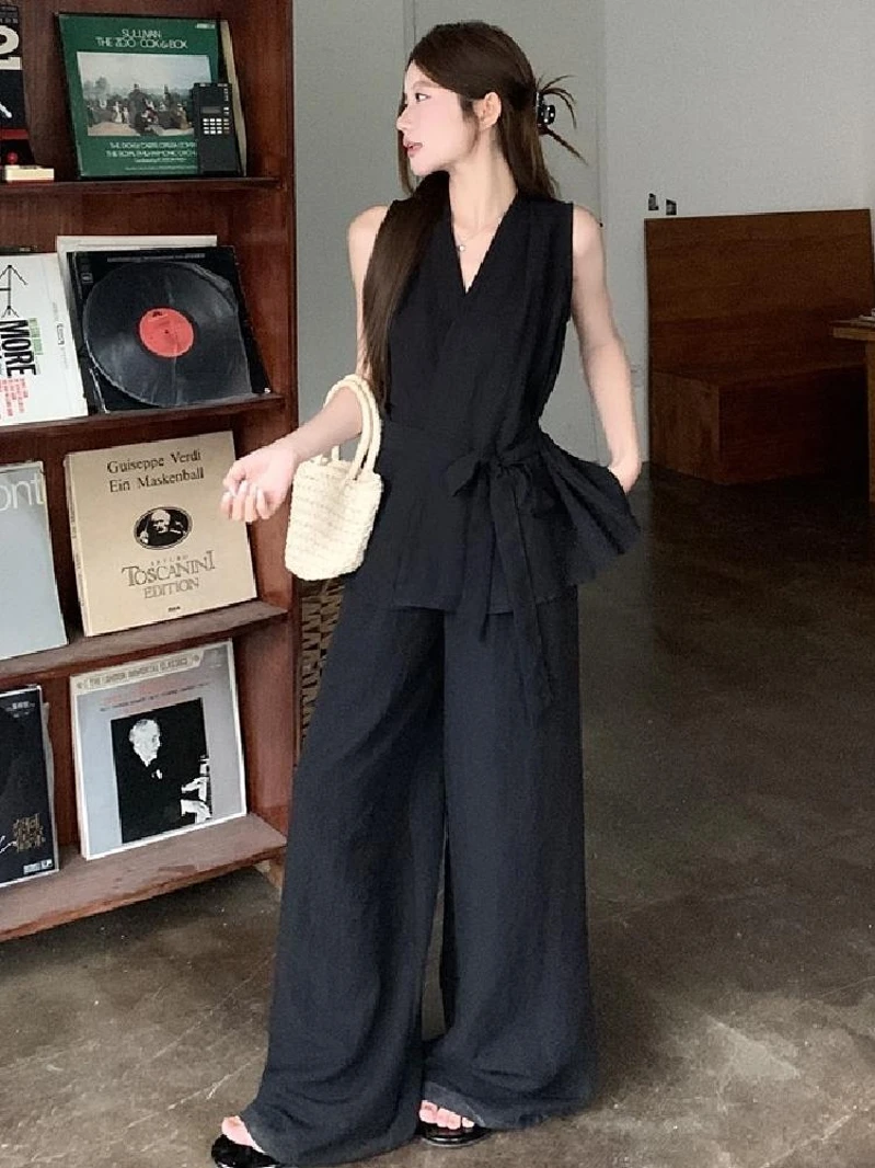 Chic Monochrome Elegance: Black Sleeveless Jumpsuit Ensemble
