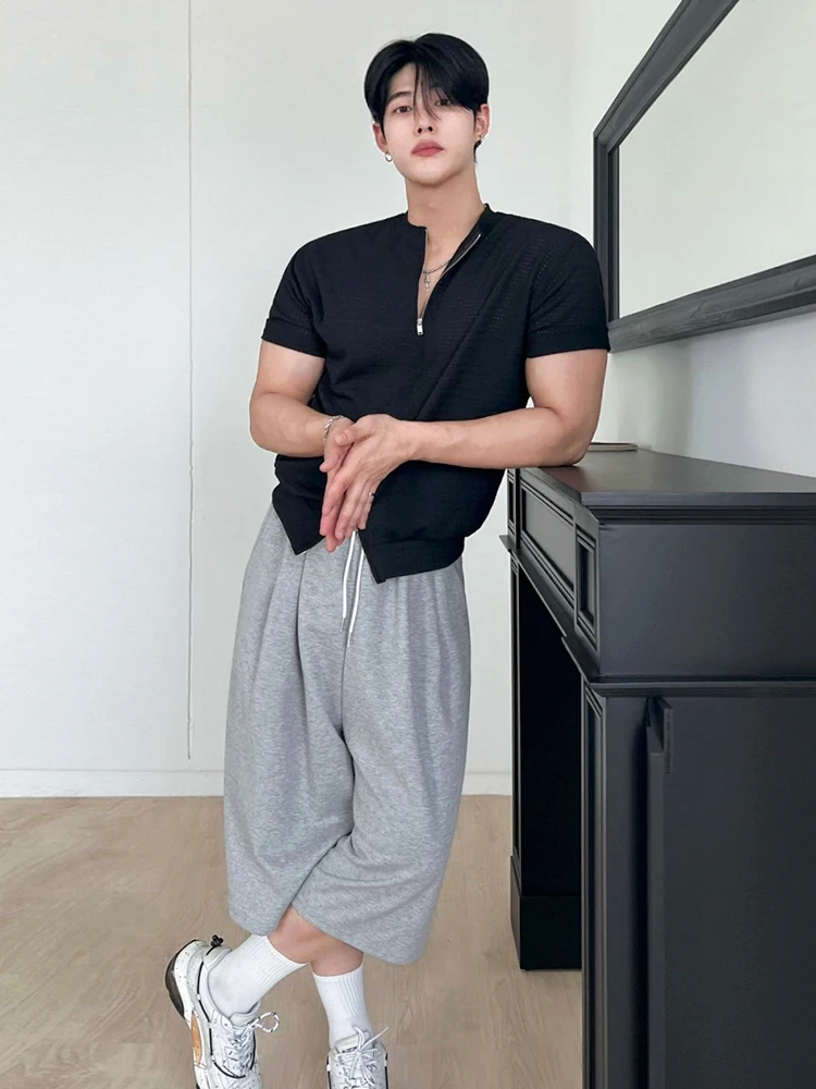 Center-Part Hair + Half-Zip Ribbed Knit Polo + Drawstring Drop-Crotch Sweat Shorts + White Chunky Running Sneakers