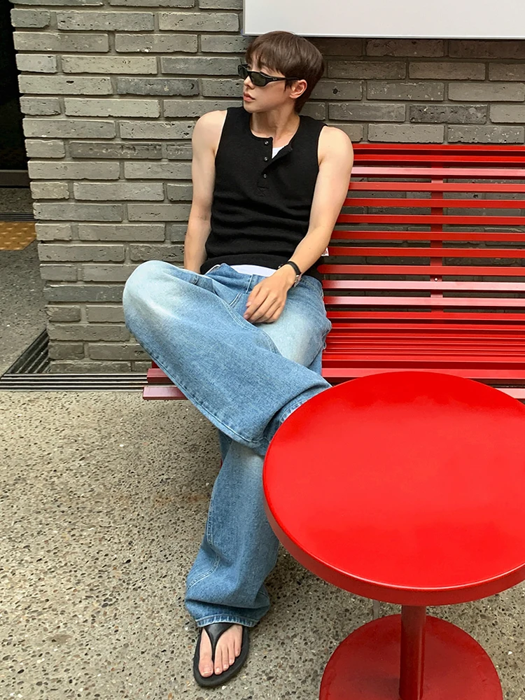 Black Sleeveless Henley + Light-Wash Flared Jeans + Minimal Flip-Flops