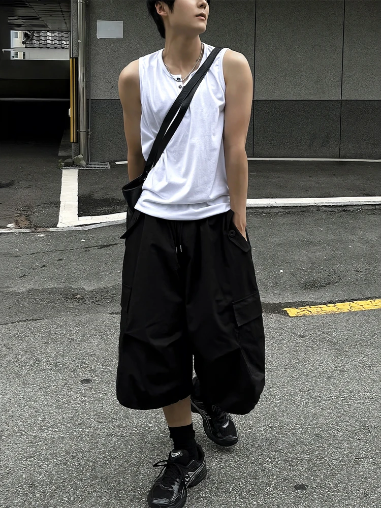 White Sleeveless Henley + Balloon Cargo Shorts + Chunky Trail Runners