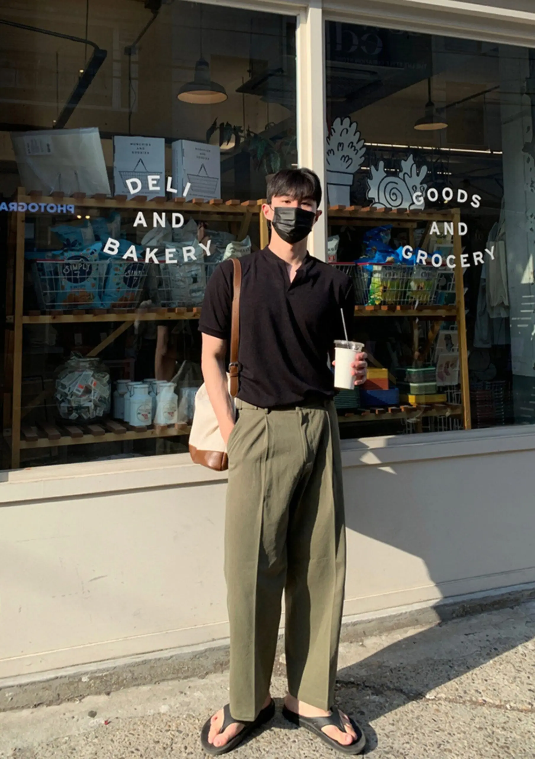 Split-Neck Black Polo + Pleated Olive Trousers + Black Flip-Flops