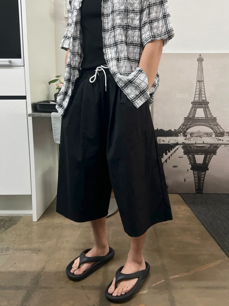 7. Effortless Layered Neutrals with Plaid Flair