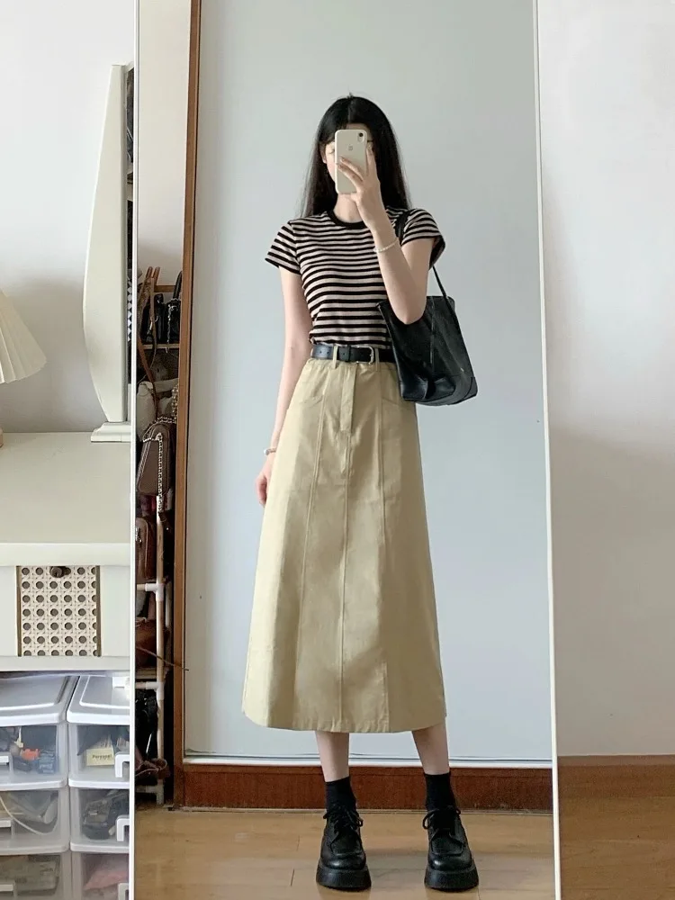 Black-and-Brown Stripe Tee + Camel A-Line Midi Skirt + Black Combat Boots