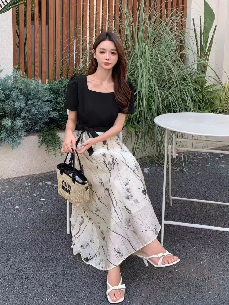 Black Square-Neck Puff-Sleeve Top + Ink-Wash Flowy Maxi Skirt + White Strappy Heels