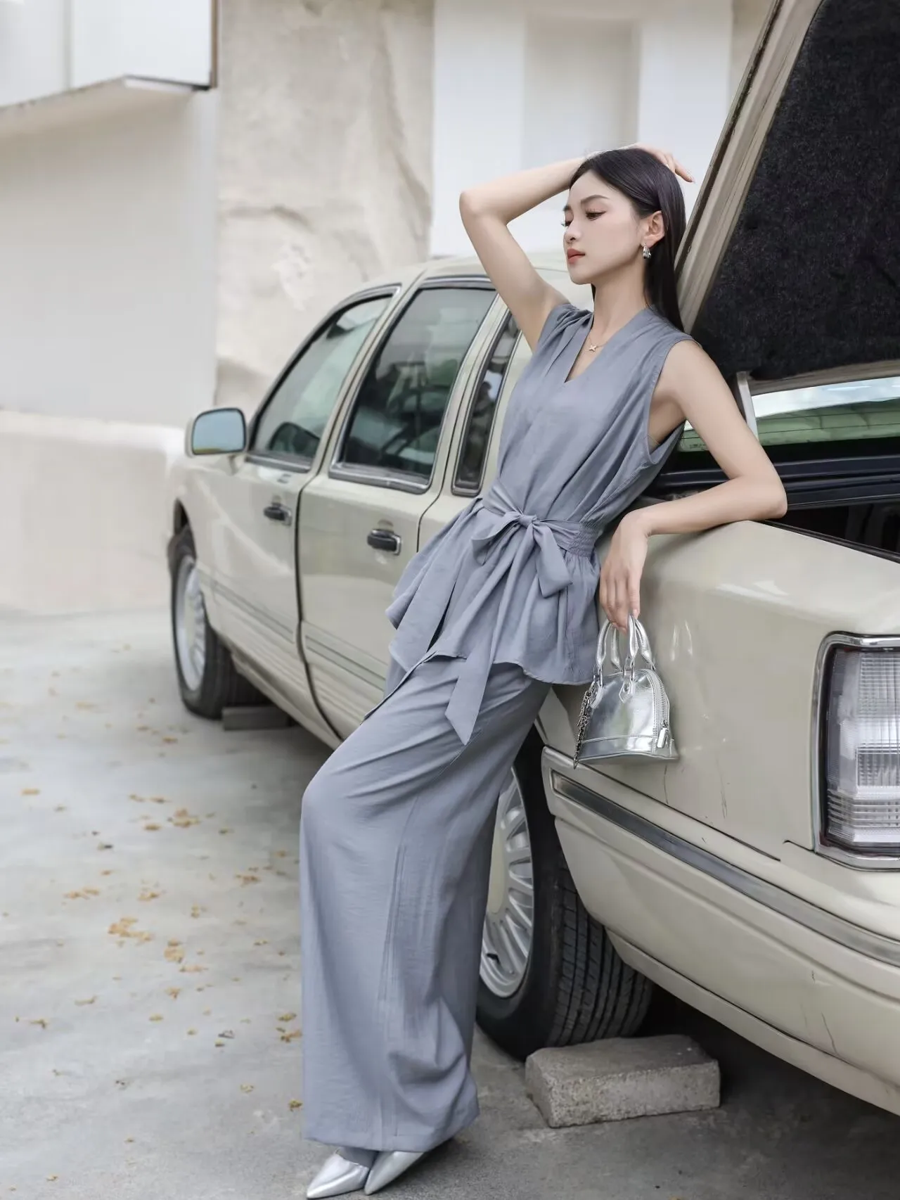 Grey Sleeveless Tie-Waist Wrap Top + Grey Wide-Leg Pants + Silver Stiletto Heels