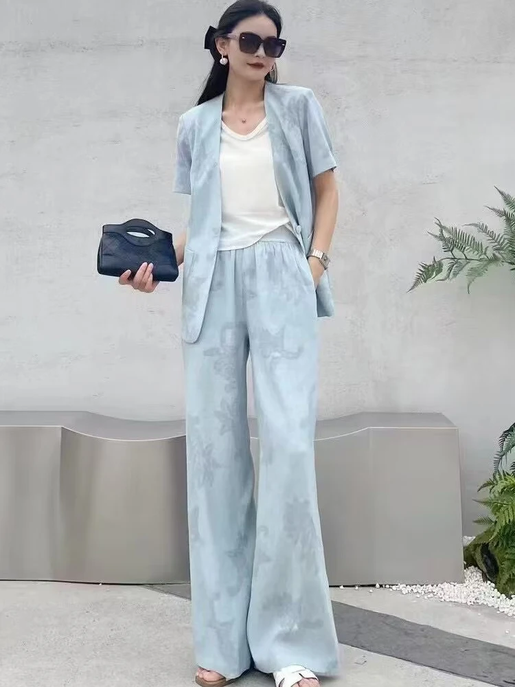 Black Bow Hair Clip + Oversized Sunglasses + Powder-Blue Short-Sleeve Blazer + Ivory Tank + Powder-Blue Wide-Leg Pants + White Slide Sandals