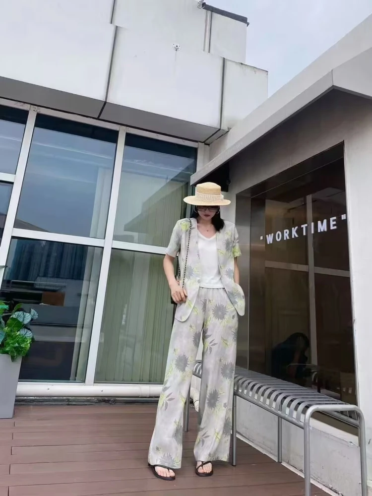 Straw hat + floral linen blazer + white tee + matching linen trousers + black flip-flops