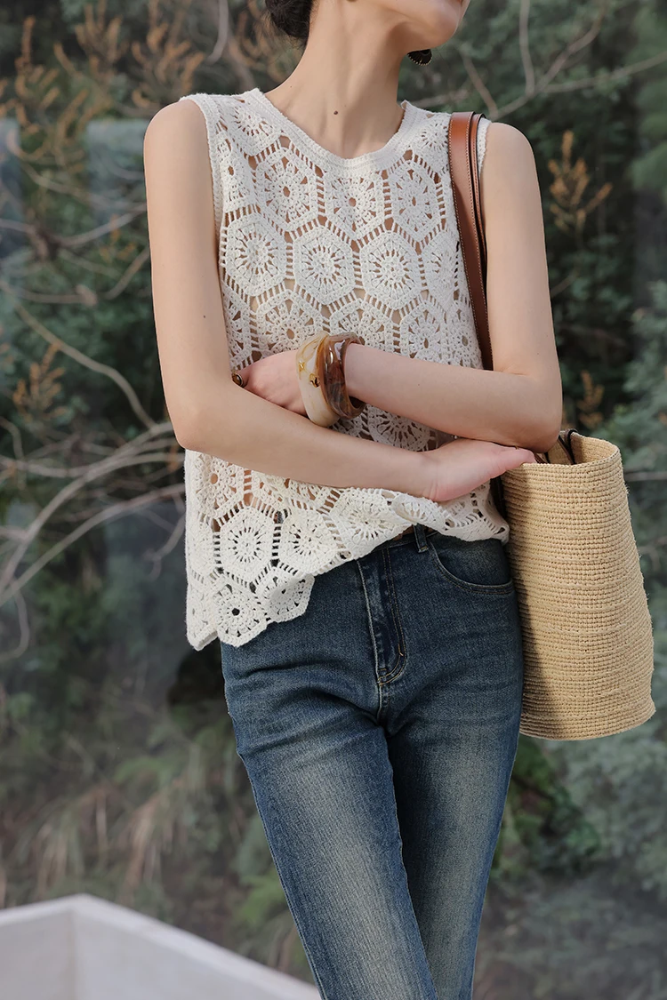 Messy low bun + ivory crochet tank + mid-rise indigo skinny jeans + straw bucket bag