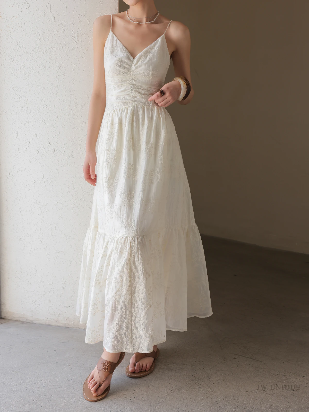 Whisper-thin spaghetti straps + ivory ruched sundress + leather flip-flops