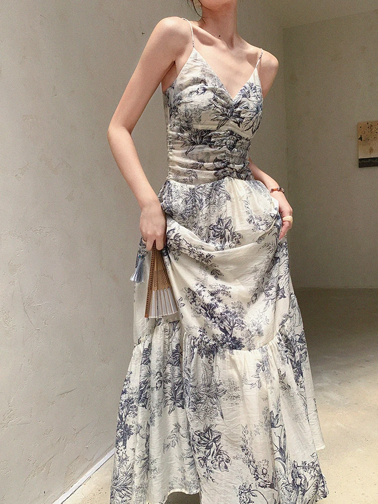 Tousled up-do + toile-print spaghetti-strap tiered dress + lacquered folding fan