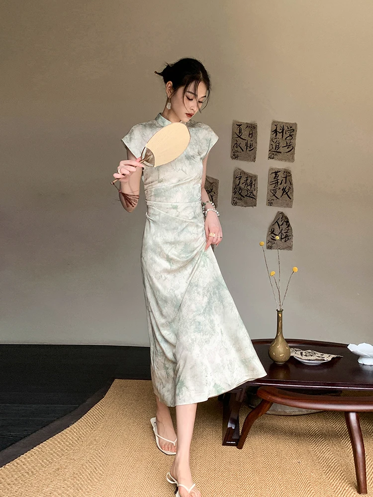 Wispy top-knot + marble wash qipao + white fan + sculptural earrings