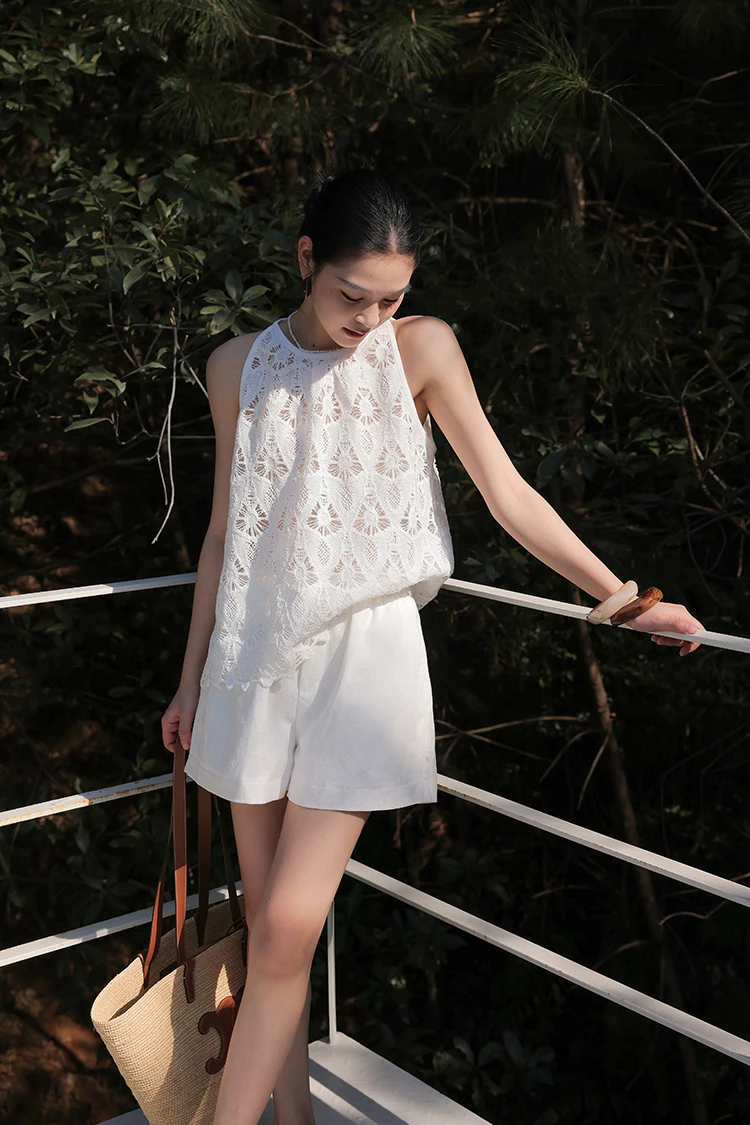 Slick ponytail + white lace halter tank + tailored white shorts + straw market tote