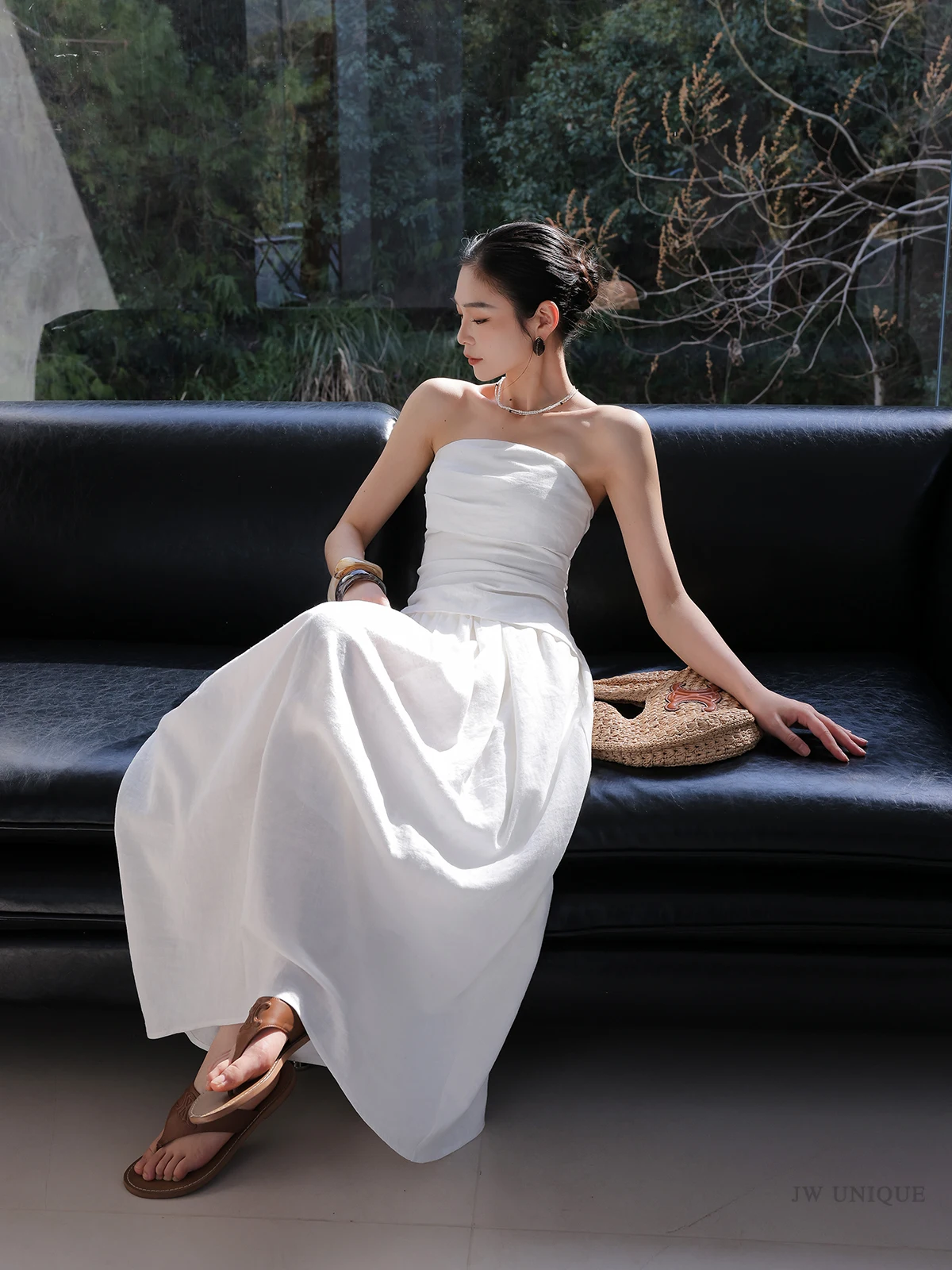 Braided chignon + white strapless midi dress + tan leather slides