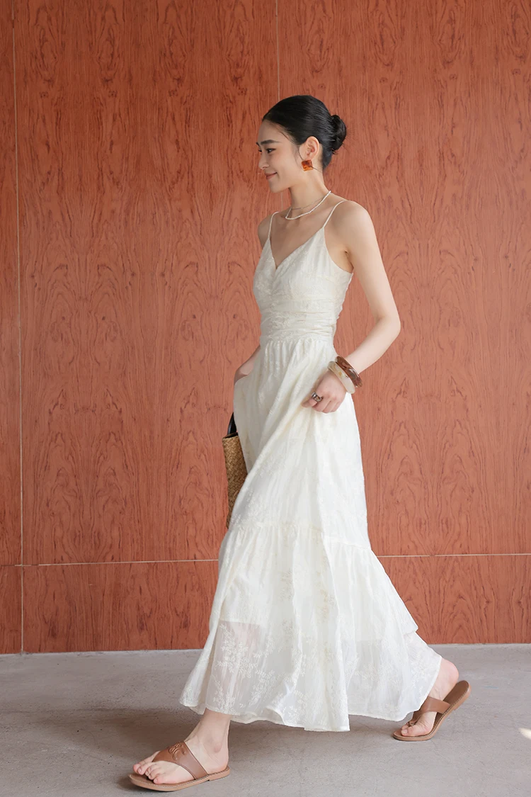 Polished bun + ivory lace-trim spaghetti dress + woven clutch