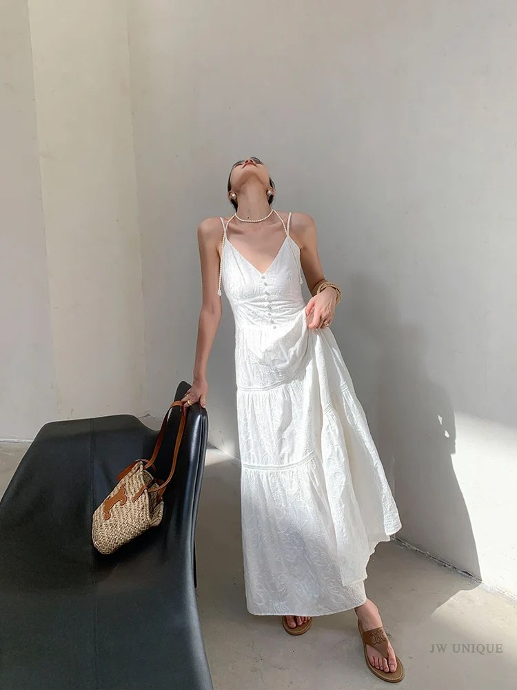 Wide straw boater + sky-blue tiered sundress + white T-strap sandals