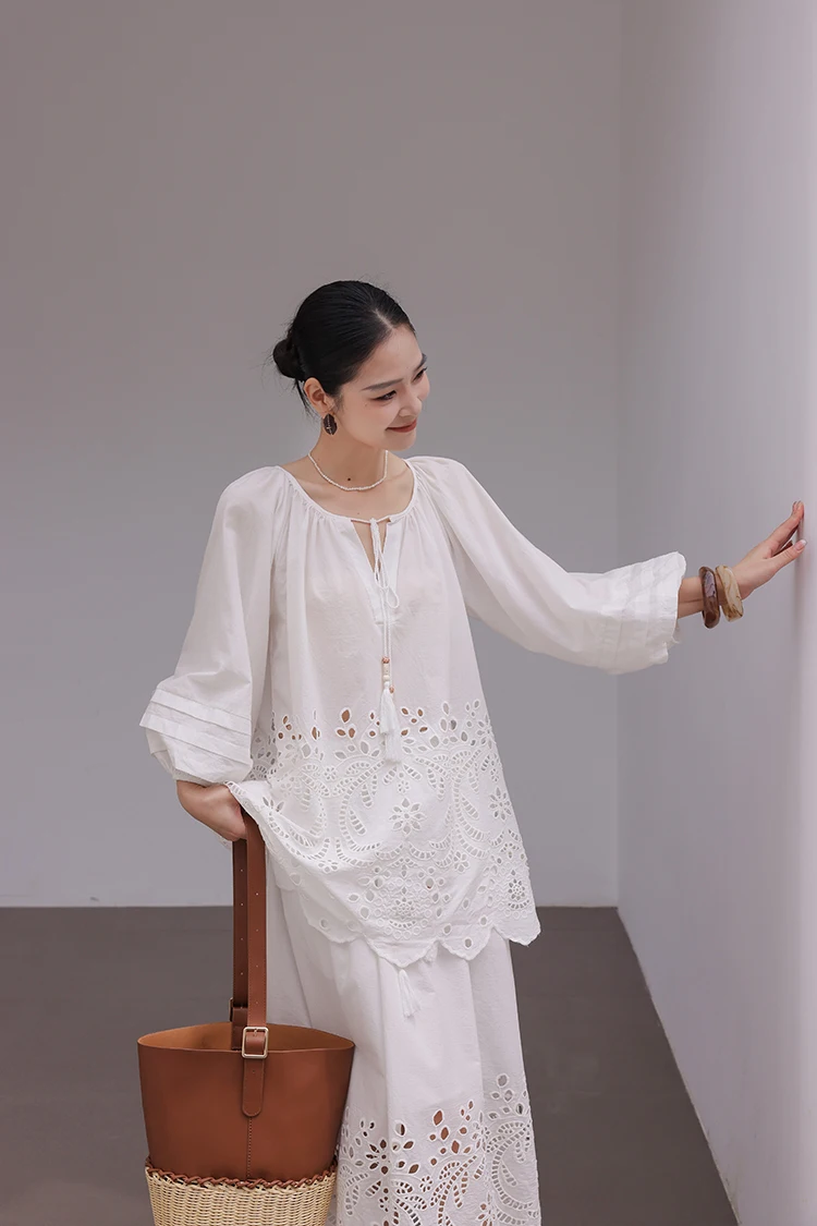Eyelet lantern-sleeve blouse + broderie maxi skirt + bucket tote