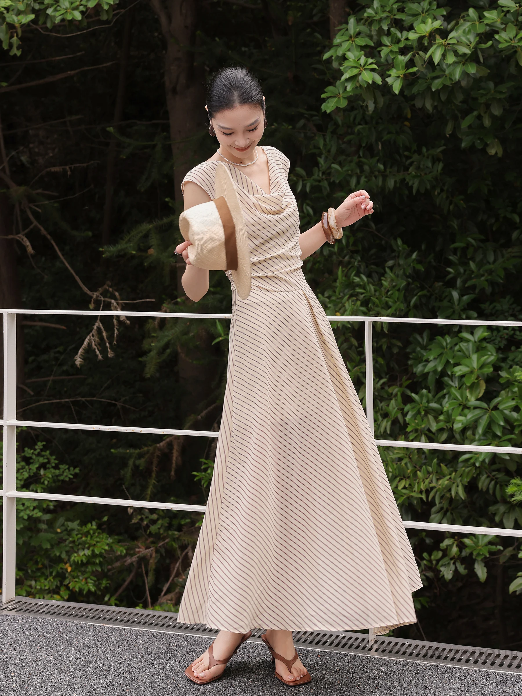 Panama hat + striped draped-neck maxi dress