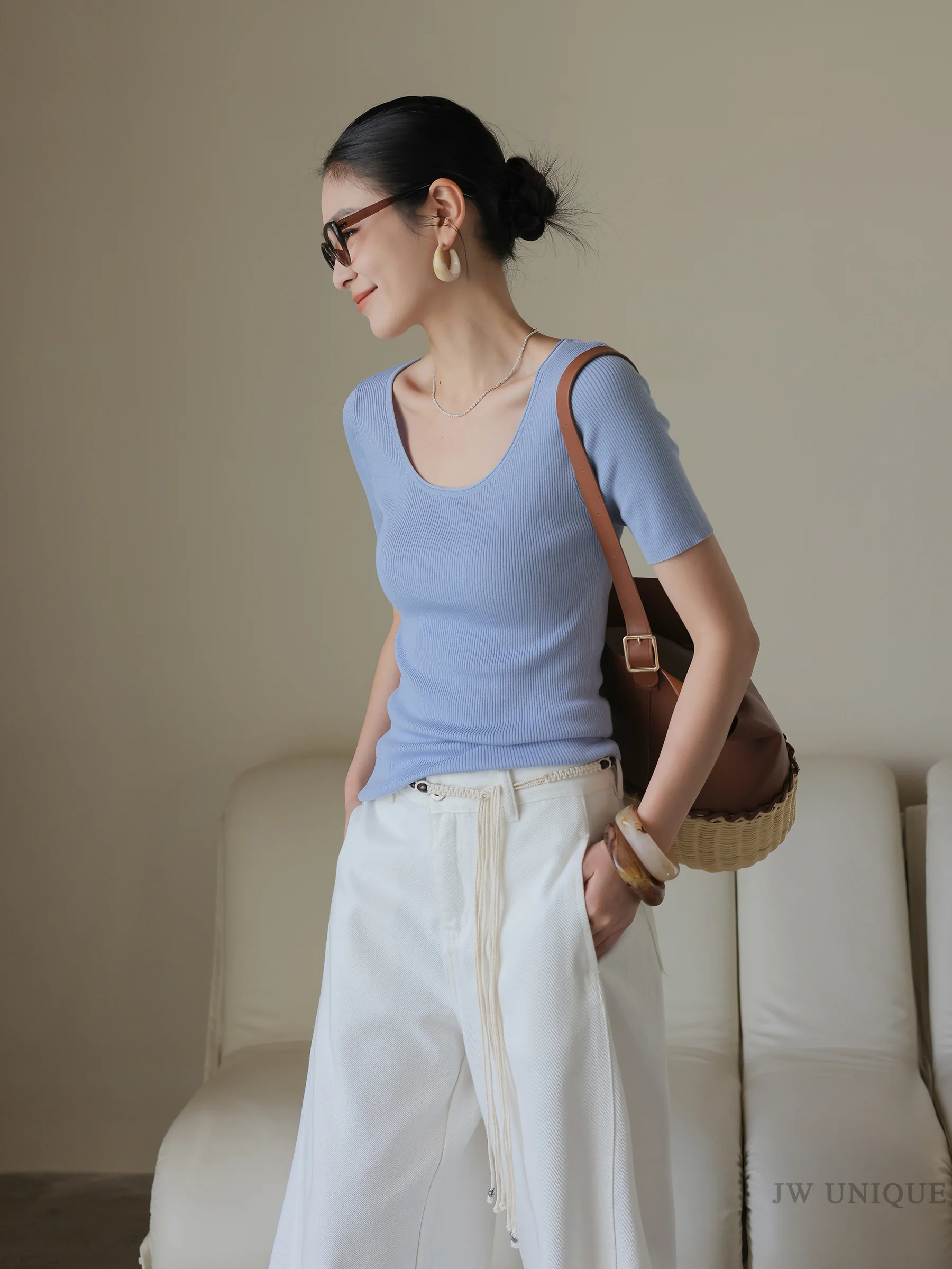 Retro sunglasses + sky-blue knit tee + rope-belted white trousers