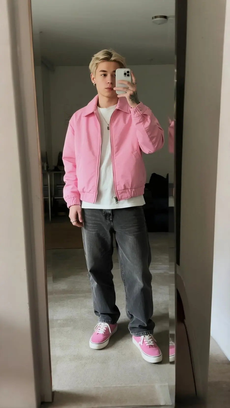 Pink Windbreaker + White Tee + Loose Charcoal Jeans + Pink‑White Low‑Top Sneakers + Layered Silver Chains