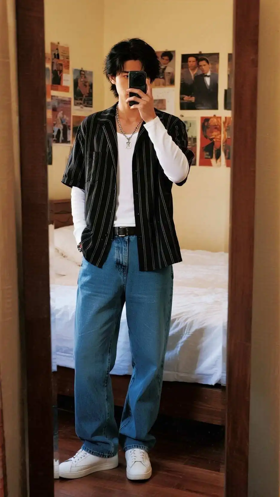 Black Pinstripe Open Shirt + White Long‑Sleeve Tee + Sky‑Blue Baggy Jeans + White Skate Sneakers + Tiny Silver Pendant + Red Phone Prop