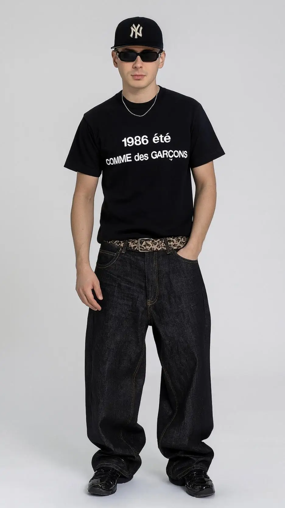 Comme des Garçons Black Tee + Leopard Belt + Wide Dark Jeans + Black Sneakers