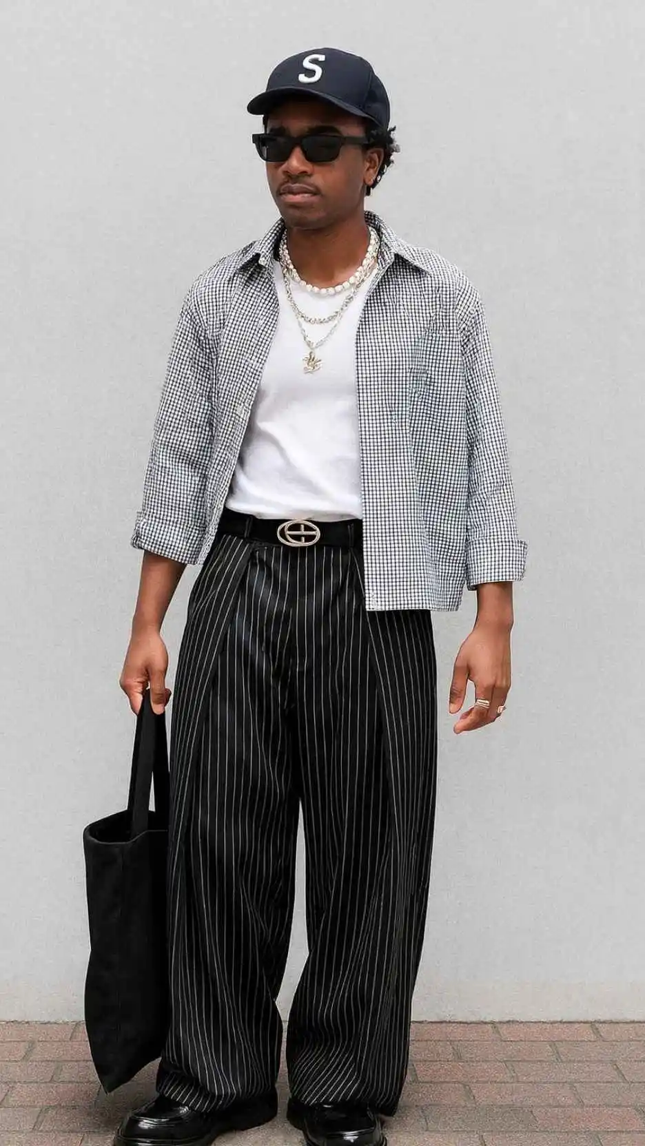 Checkered Open Shirt + White Tank Top + Striped Wide Trousers + Logo Buckle Belt + Black Loafers + Layered Necklaces + Black Tote