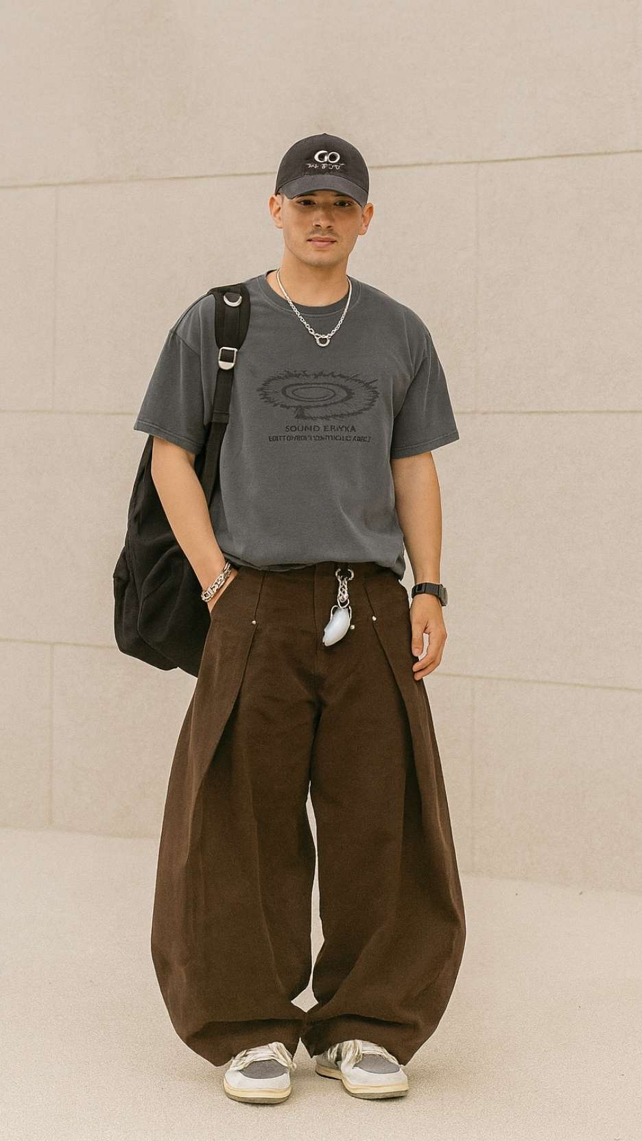 Graphic Cap + Charcoal Tee + Brown Super-Wide Canvas Pants + Grey Skate Sneakers