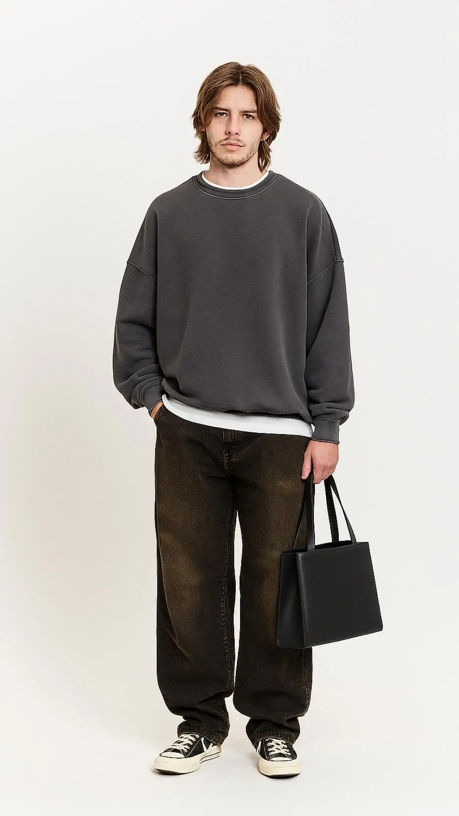 Charcoal Oversized Sweatshirt + White Tee Peek + Brown Washed Puddle Jeans + Mini Black Tote + Grey Vintage Sneakers