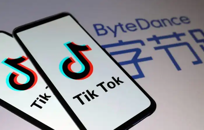 Two phones display the TikTok logo with the ByteDance logo in the background.