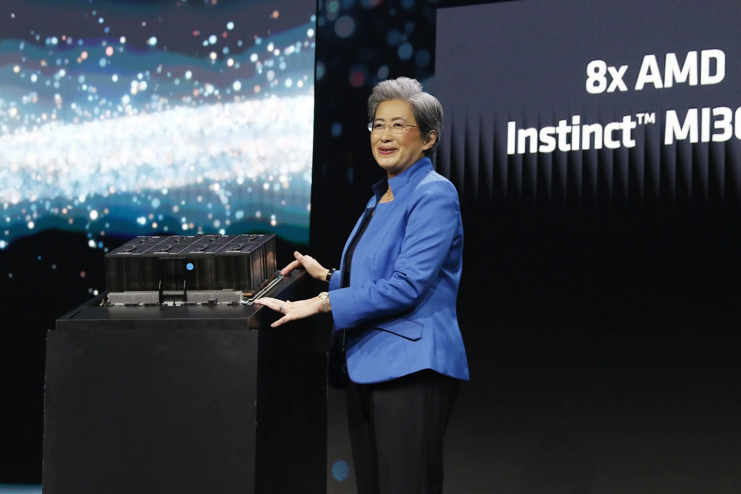 Lisa Su onstage with MI300X processors