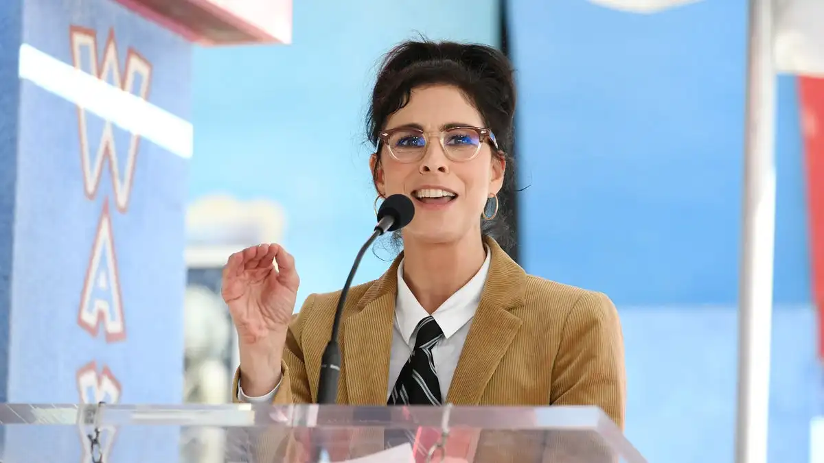 Comedian Sarah Silverman speaking at a podium