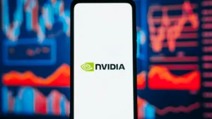 NVIDIA company logo on smartphone against background of red stock chart. Business crisis, collapse of trading and investment, bankruptcy, falling value concept. NVDA stock