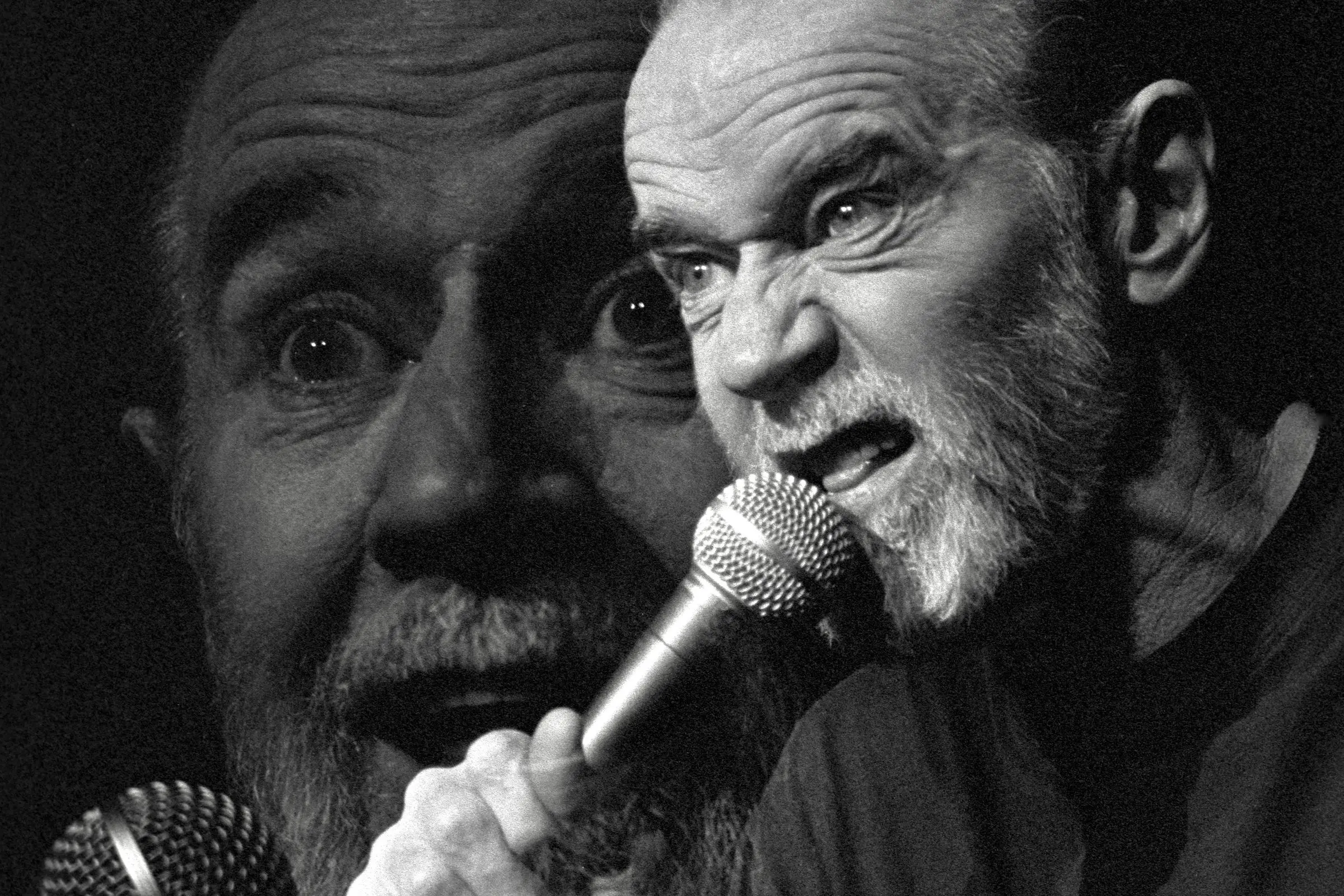 George Denis Patrick Carlin performs a standup routine at the Cheyenne Civic Center on June 1, 1992 in Cheyenne, Wyoming.